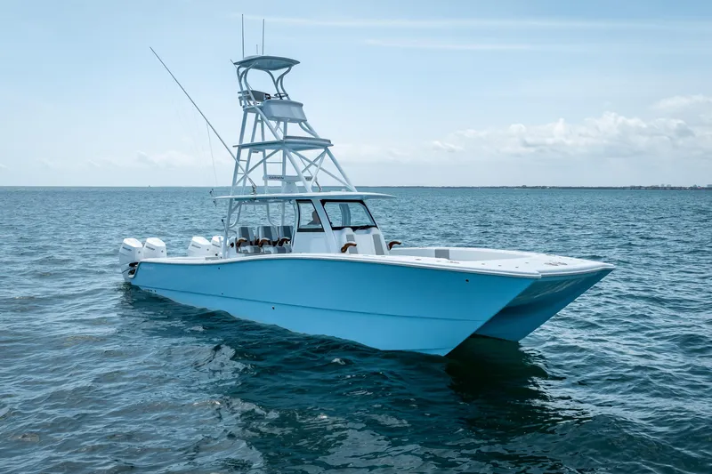 Cya Yacht Photos Pics 2025 Freeman 43 boat on open sea, featuring sleek design and multiple engines.