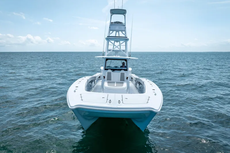 Cya Yacht Photos Pics Front view of a 2025 Freeman 43 boat on open water under a clear sky.