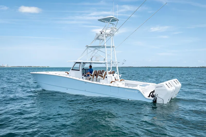 Cya Yacht Photos Pics 2025 Freeman 43 boat on open water, featuring dual Mercury engines.