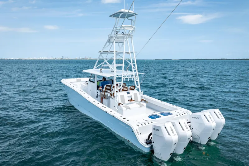 Cya Yacht Photos Pics 2025 Freeman 43 boat on open water, featuring multiple outboard engines.