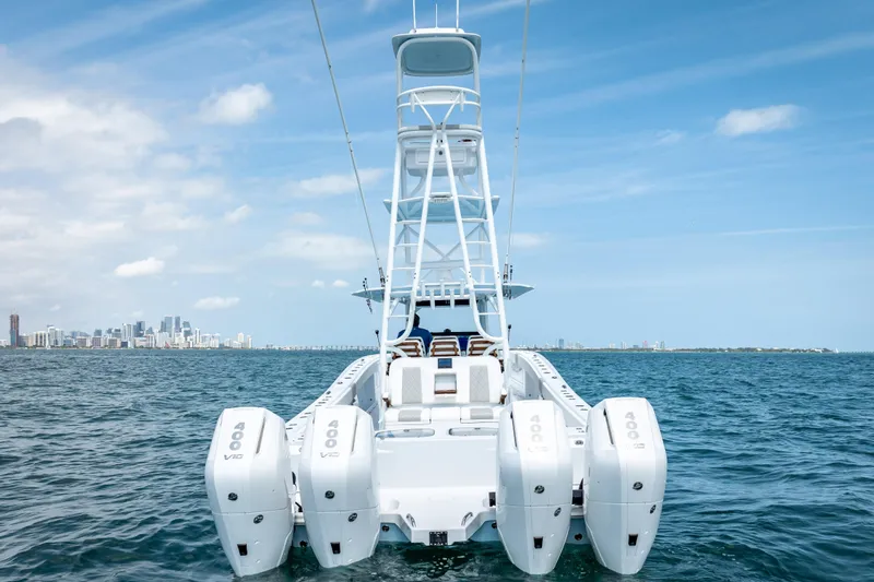 Cya Yacht Photos Pics Freeman 43 boat with four engines on open water, city skyline in background, 2025 model.