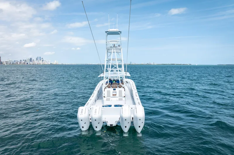 Cya Yacht Photos Pics 2025 Freeman 43 boat on open water with city skyline in background.