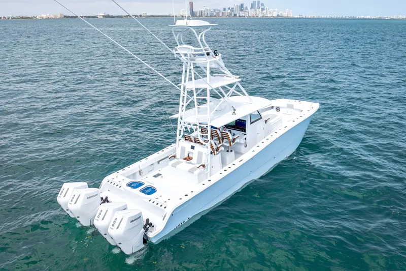 Cya Yacht Photos Pics 2025 Freeman 43 boat on open water with city skyline in background.