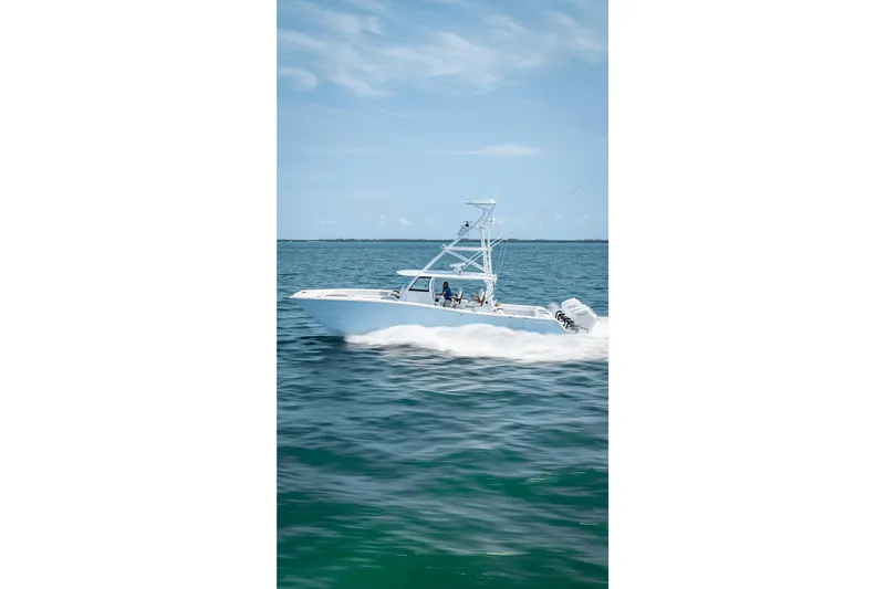 Cya Yacht Photos Pics 2025 Freeman 43 boat cruising on open water under a clear blue sky.