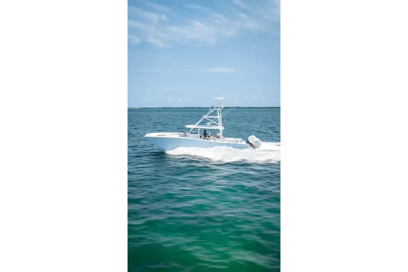 Cya Yacht Photos Pics 2025 Freeman 43 boat cruising on open water under clear blue sky.