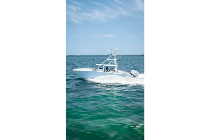 Cya Yacht Photos Pics 2025 Freeman 43 boat cruising on clear blue ocean waters.