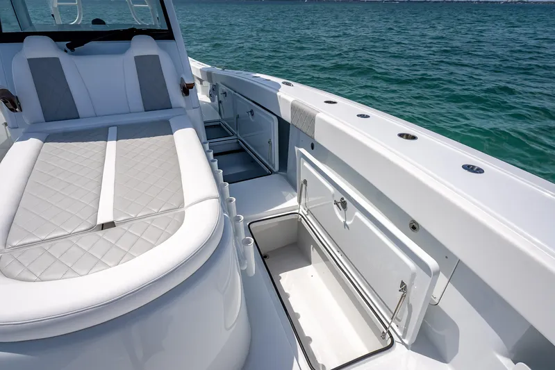 Cya Yacht Photos Pics Luxurious 2025 Freeman 43 boat interior with cushioned seating and storage, on open water.