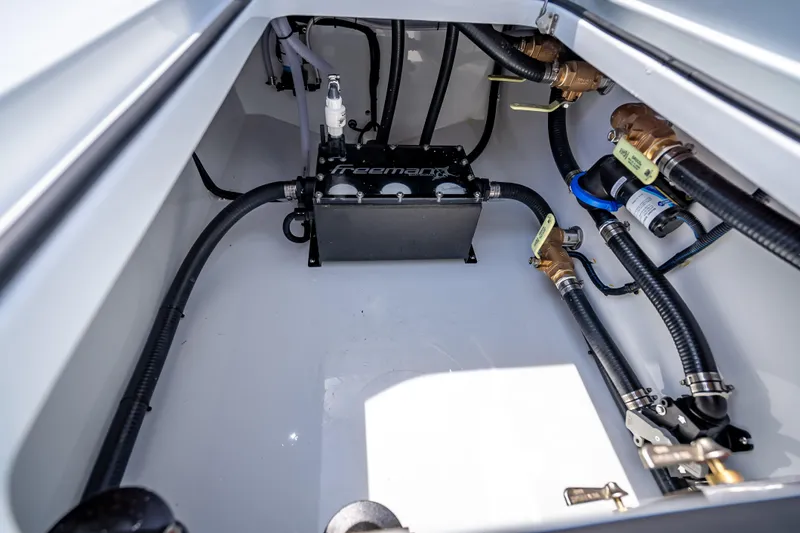 Cya Yacht Photos Pics 2025 Freeman 43 boat engine compartment with hoses and mechanical components.