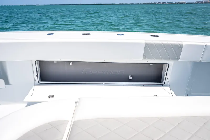 Cya Yacht Photos Pics 2025 Freeman 43 boat interior with storage compartment, ocean view in background.