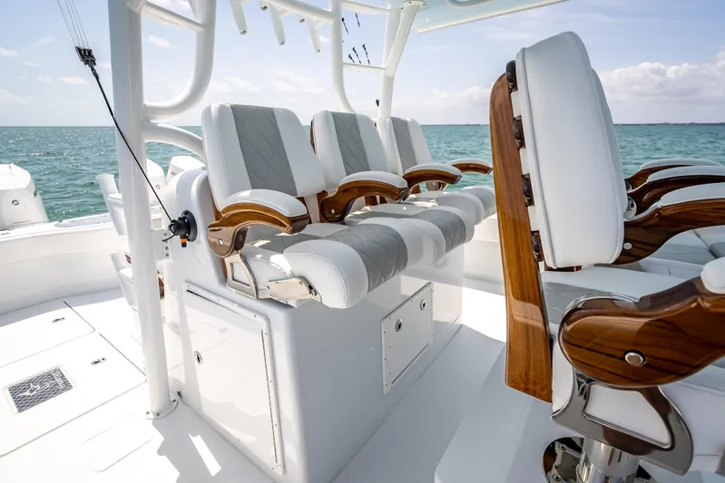 Cya Yacht Photos Pics Luxury seating on a 2025 Freeman 43 boat, featuring elegant wood and white upholstery.