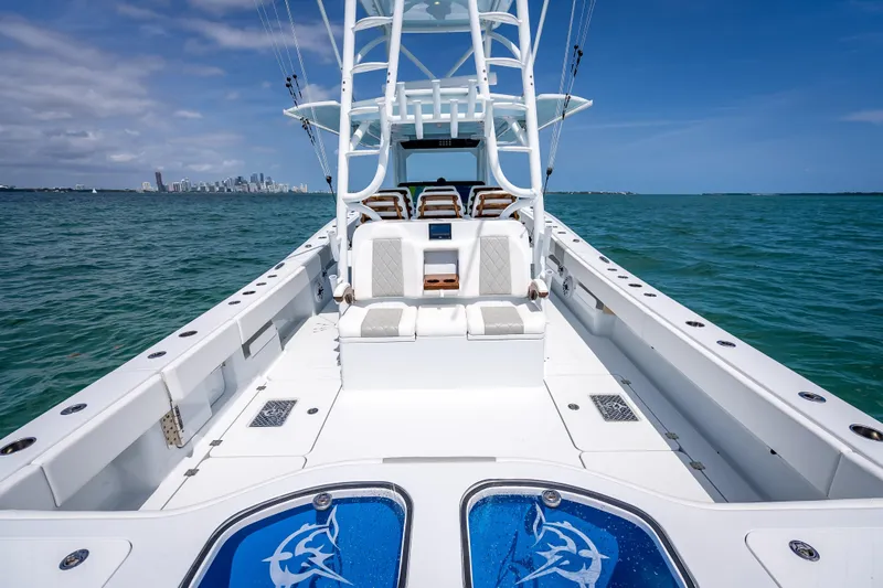 Cya Yacht Photos Pics 2025 Freeman 43 boat on open water with city skyline in background.