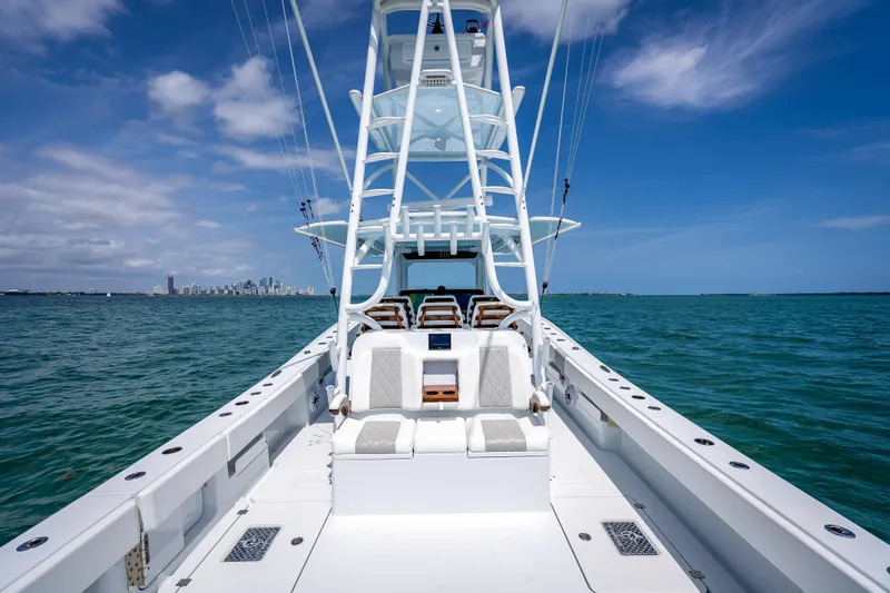 Cya Yacht Photos Pics 2025 Freeman 43 boat on open water with city skyline in background.