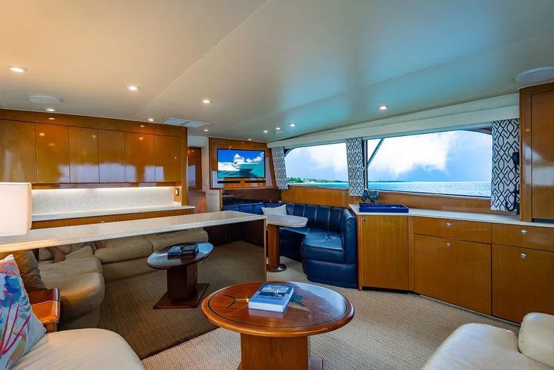  Yacht Photos Pics Luxurious interior of a 1999 Viking Convertible yacht with ocean view and elegant furnishings.