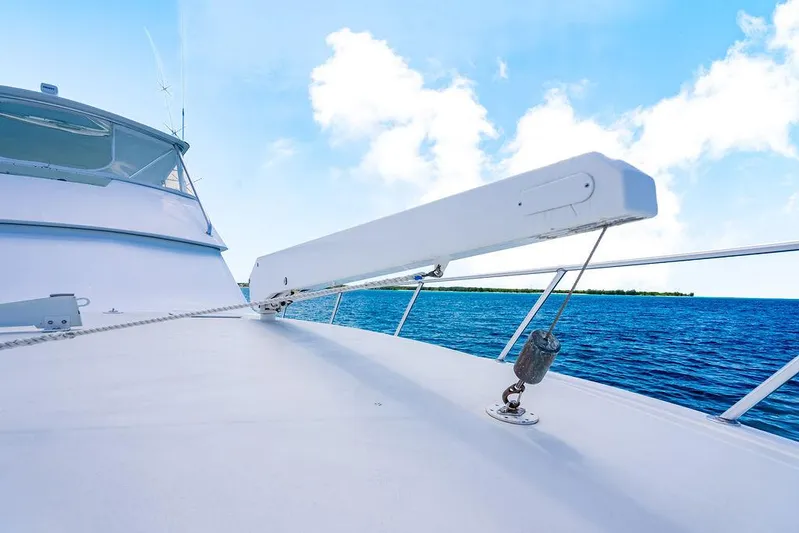  Yacht Photos Pics 1999 Viking Convertible yacht deck with ocean view under clear blue sky.