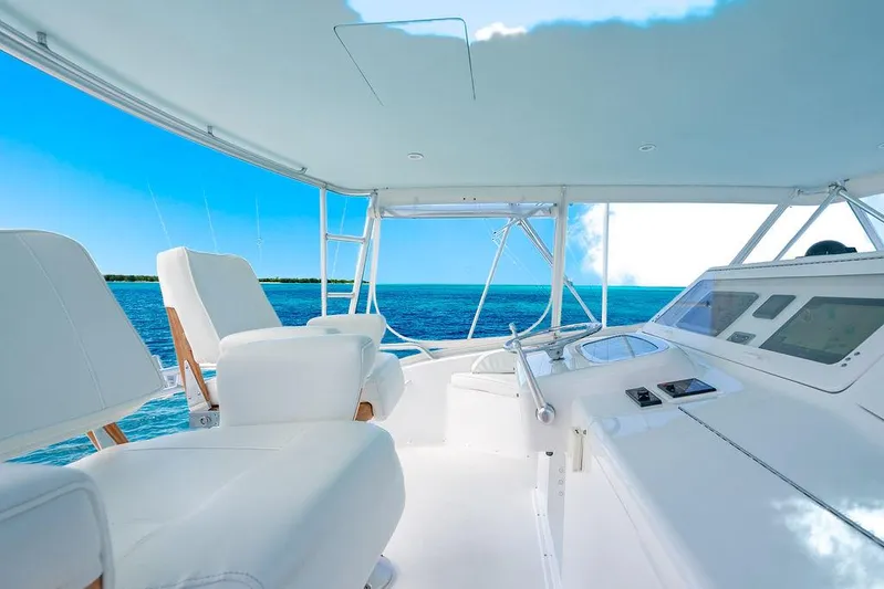  Yacht Photos Pics Luxurious 1999 Viking Convertible yacht interior with ocean view and modern controls.