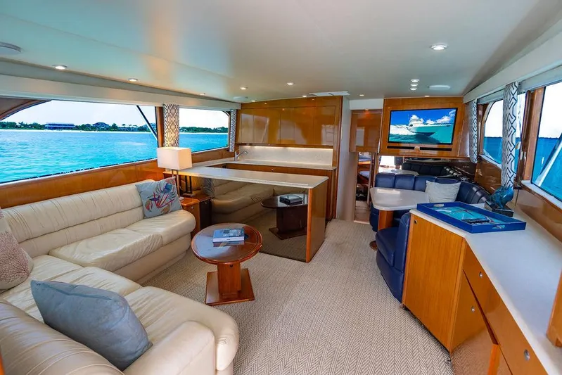  Yacht Photos Pics Luxurious interior of a 1999 Viking Convertible yacht with elegant furnishings and scenic ocean view.