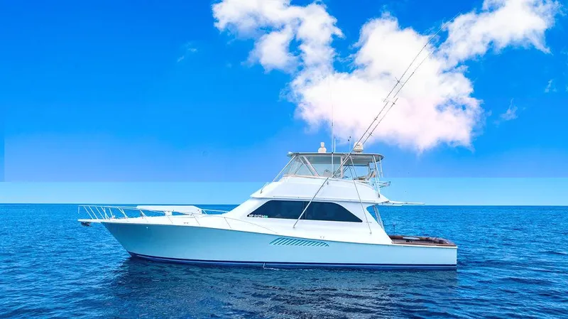  Yacht Photos Pics 1999 Viking Convertible yacht on open sea under clear blue sky.