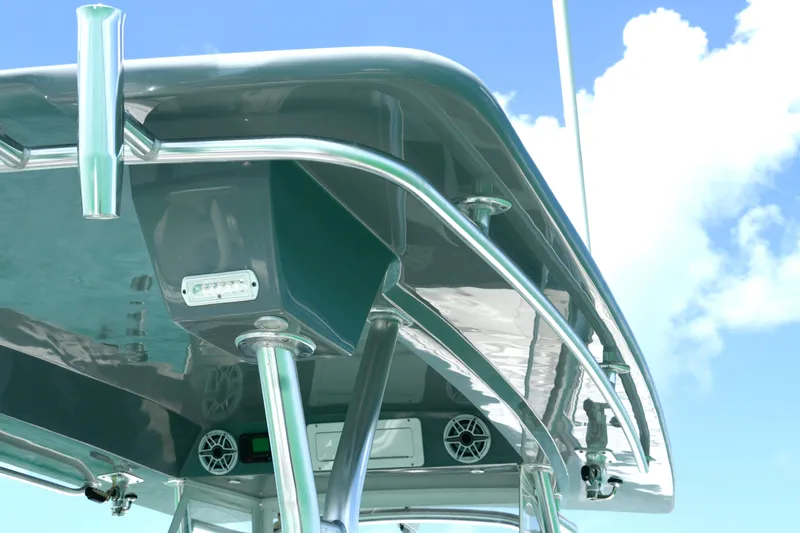  Yacht Photos Pics 2023 Prowler Renaissance Prowler 36 boat canopy with speakers and lights against blue sky.