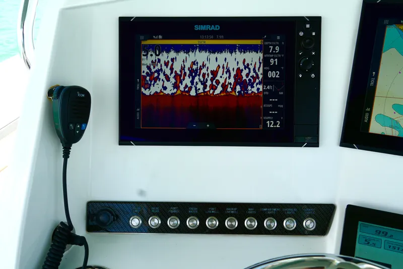  Yacht Photos Pics Control panel of 2023 Prowler Renaissance Prowler 36 with Simrad display and Icom radio.