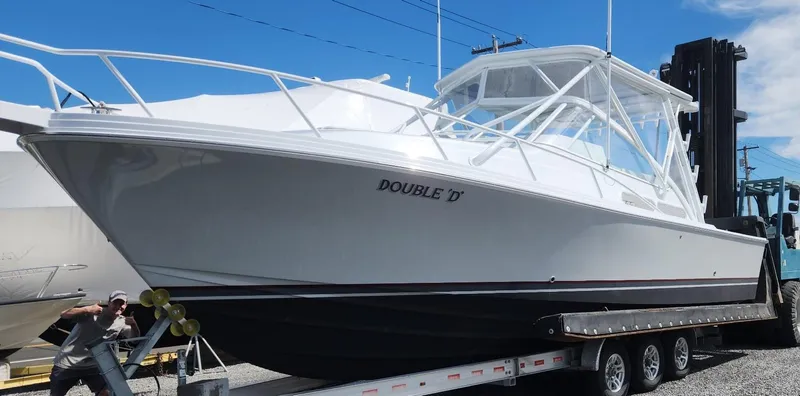  Yacht Photos Pics 1996 Blackfin 33 Combi boat on trailer, named "Double D," in a marina setting.