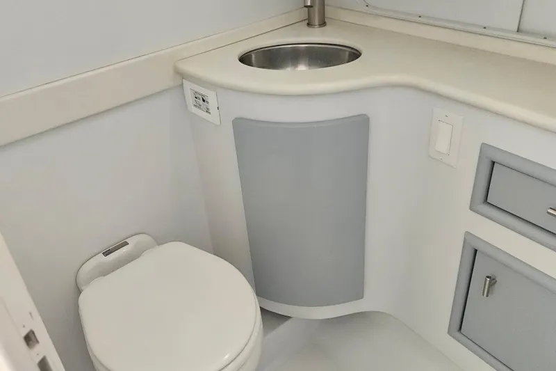  Yacht Photos Pics Bathroom interior of 1996 Blackfin 33 Combi boat, featuring toilet and sink.