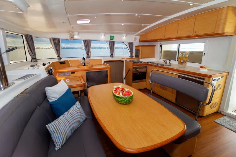  Yacht Photos Pics Interior of 2010 Lagoon 440 catamaran with modern kitchen and dining area.