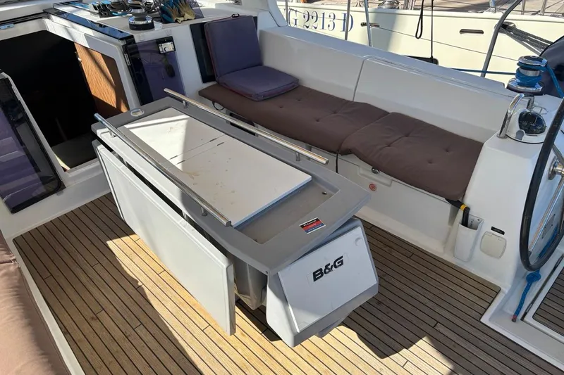  Yacht Photos Pics Beneteau Oceanis 45 cockpit, 2019 model, featuring teak flooring and comfortable seating.