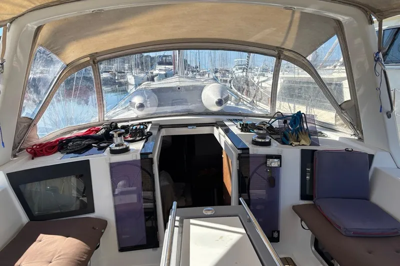  Yacht Photos Pics 2019 Beneteau Oceanis 45 cockpit with seating, winches, and marina view.