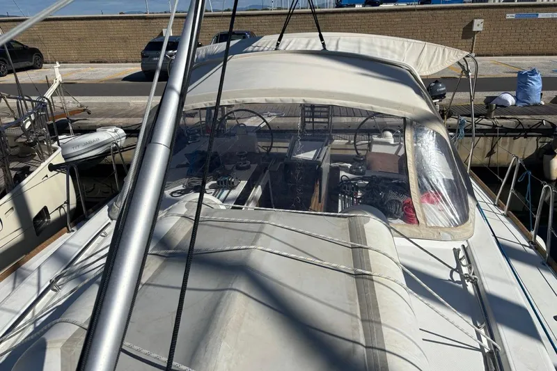  Yacht Photos Pics 2019 Beneteau Oceanis 45 sailboat docked at marina, view of cockpit and deck.