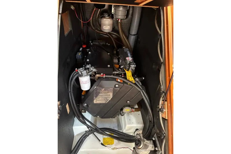  Yacht Photos Pics Engine compartment of a 2019 Beneteau Oceanis 45 sailboat, showcasing mechanical components.