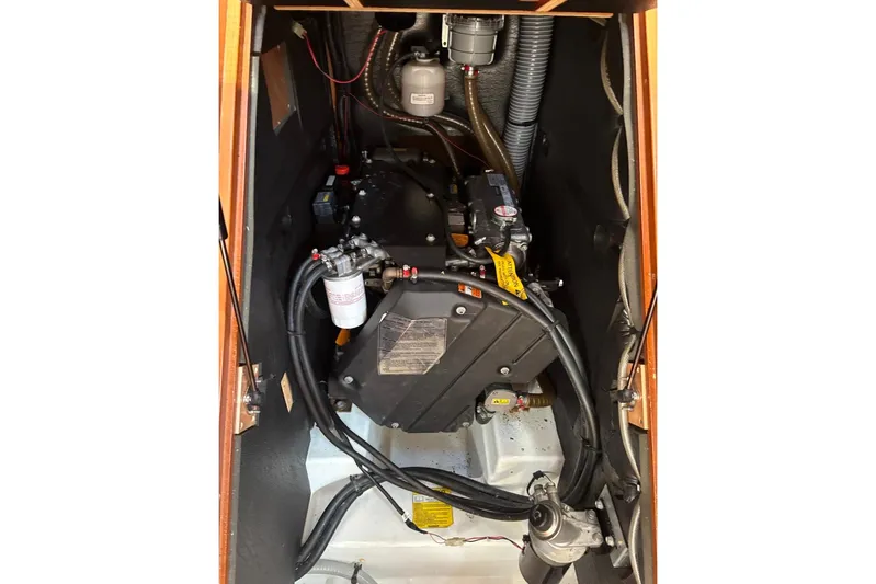  Yacht Photos Pics Engine compartment of a 2019 Beneteau Oceanis 45 sailboat, showcasing mechanical components.