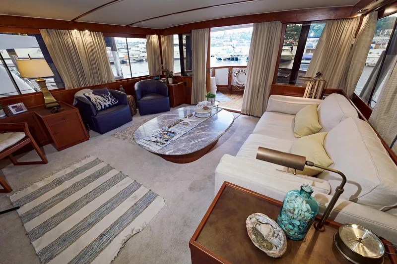 Camelot Yacht Photos Pics Luxurious interior of a 1976 Pacemaker 65 yacht with elegant furnishings.