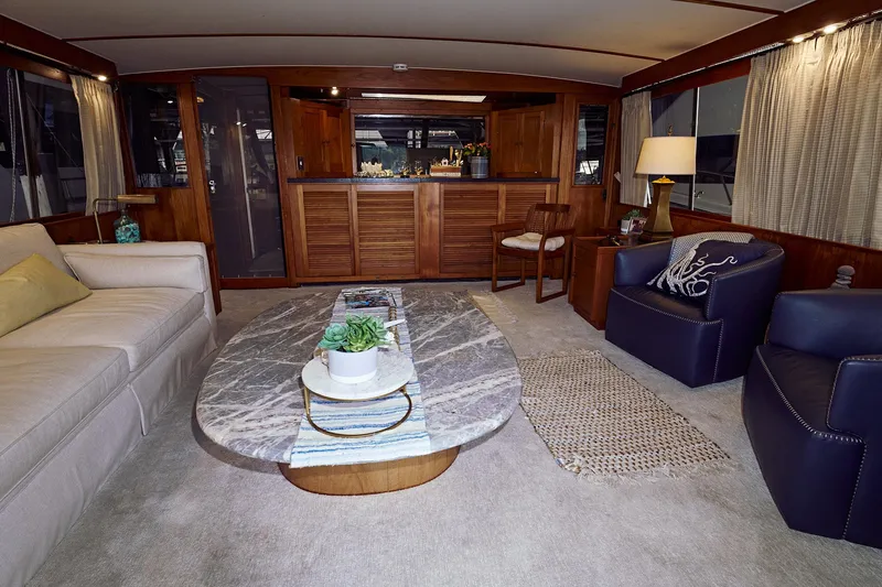 Camelot Yacht Photos Pics Luxurious 1976 Pacemaker 65 yacht interior with modern furnishings and elegant decor.