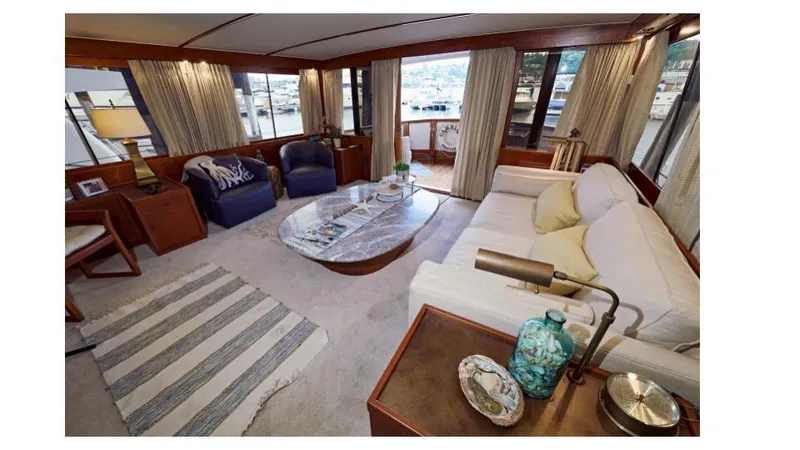 Camelot Yacht Photos Pics Luxurious interior of a 1976 Pacemaker 65 yacht with elegant furnishings.