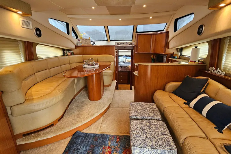  Yacht Photos Pics Luxurious interior of a 2007 Silverton 38 Sport Bridge yacht with plush seating and elegant decor.