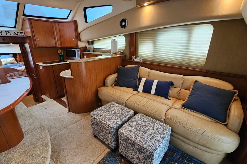  Yacht Photos Pics Interior of 2007 Silverton 38 Sport Bridge yacht with cozy seating and kitchenette.