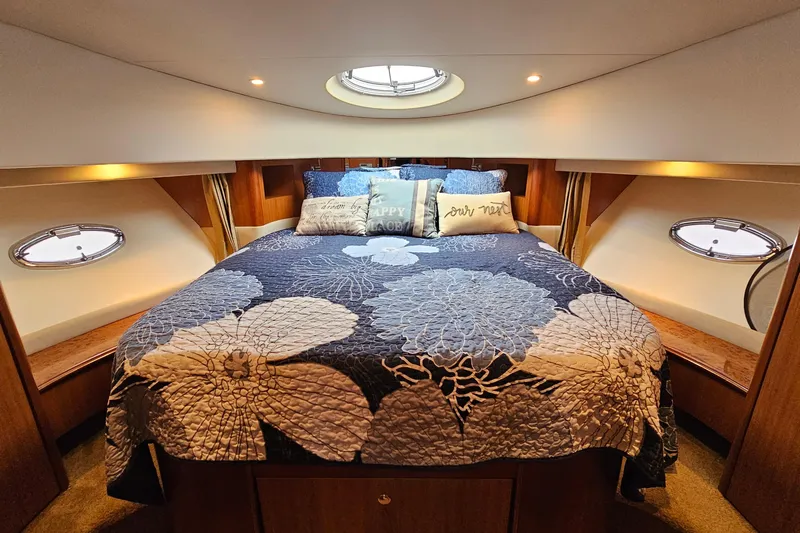  Yacht Photos Pics Luxurious cabin interior of 2007 Silverton 38 Sport Bridge yacht with floral bedding.