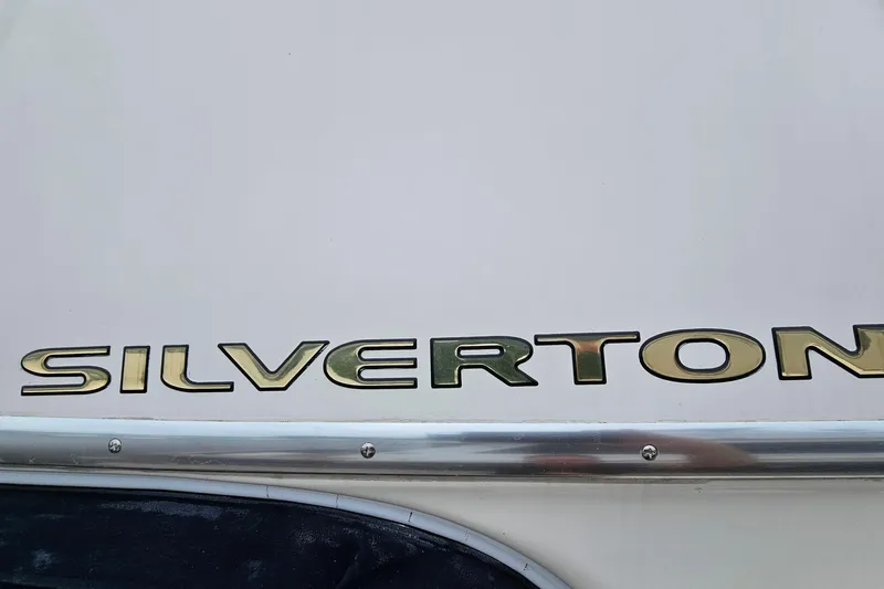  Yacht Photos Pics Silverton 38 Sport Bridge 2007 boat logo on white surface.