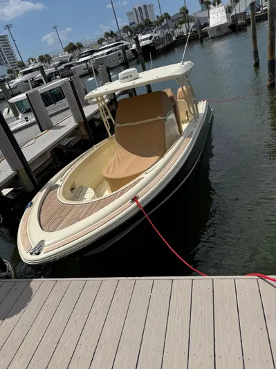  Yacht Photos Pics 2018 Chris-Craft Catalina 30 docked in a marina, showcasing elegant design and craftsmanship.