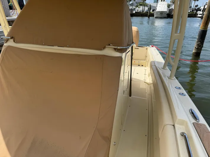  Yacht Photos Pics 2018 Chris-Craft Catalina 30 boat interior with tan cover, docked by the water.