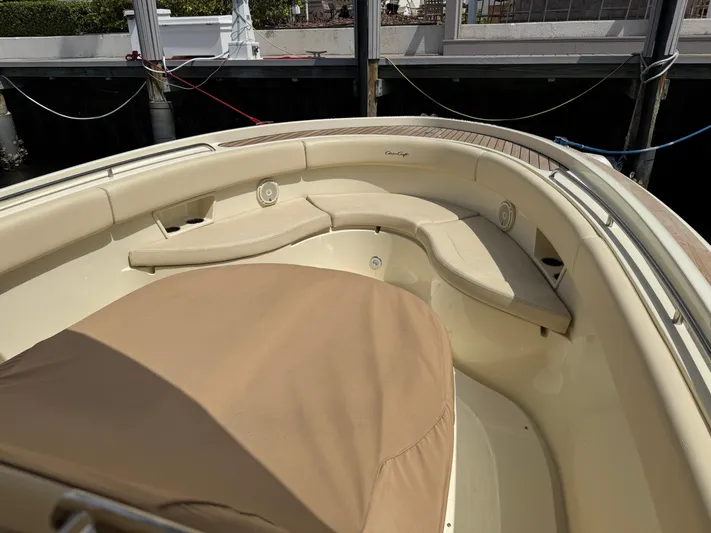  Yacht Photos Pics 2018 Chris-Craft Catalina 30 boat interior with beige seating and docked at a marina.