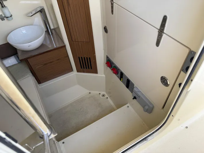  Yacht Photos Pics 2018 Chris-Craft Catalina 30 interior with sink and control panel.