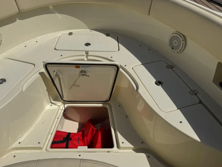  Yacht Photos Pics 2018 Chris-Craft Catalina 30 boat storage area with open hatch and life jackets.