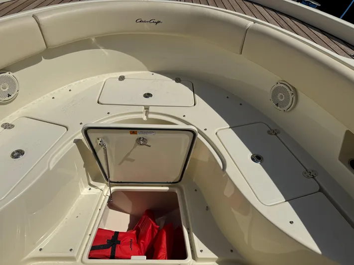  Yacht Photos Pics 2018 Chris-Craft Catalina 30 boat interior with storage compartments and life jackets.
