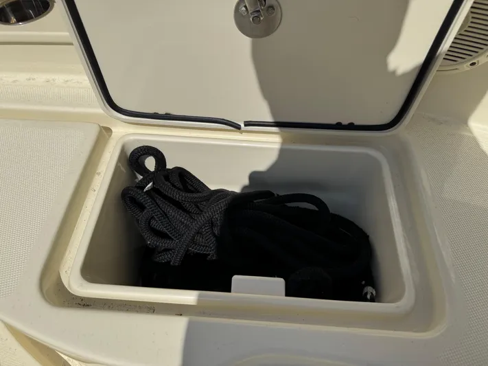  Yacht Photos Pics Storage compartment on 2018 Chris-Craft Catalina 30 boat with black rope inside.