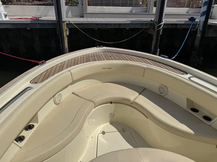  Yacht Photos Pics 2018 Chris-Craft Catalina 30 boat with elegant seating and teak accents at a dock.