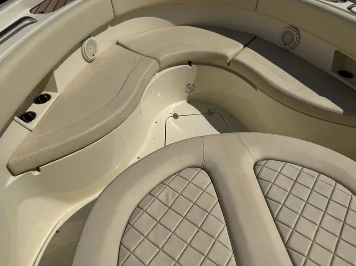  Yacht Photos Pics 2018 Chris-Craft Catalina 30 boat interior with beige cushioned seating and speakers.