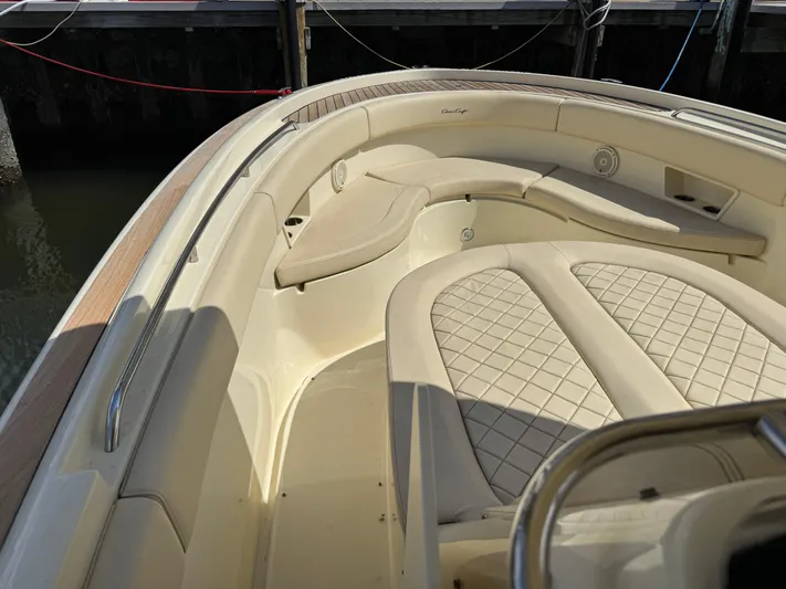  Yacht Photos Pics 2018 Chris-Craft Catalina 30 boat interior with beige cushioned seating.