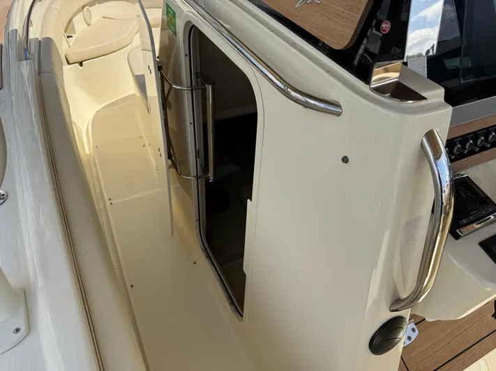  Yacht Photos Pics 2018 Chris-Craft Catalina 30 boat interior with open cabin door and sleek design.