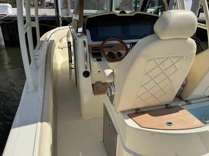  Yacht Photos Pics 2018 Chris-Craft Catalina 30 boat interior with elegant seating and modern dashboard.